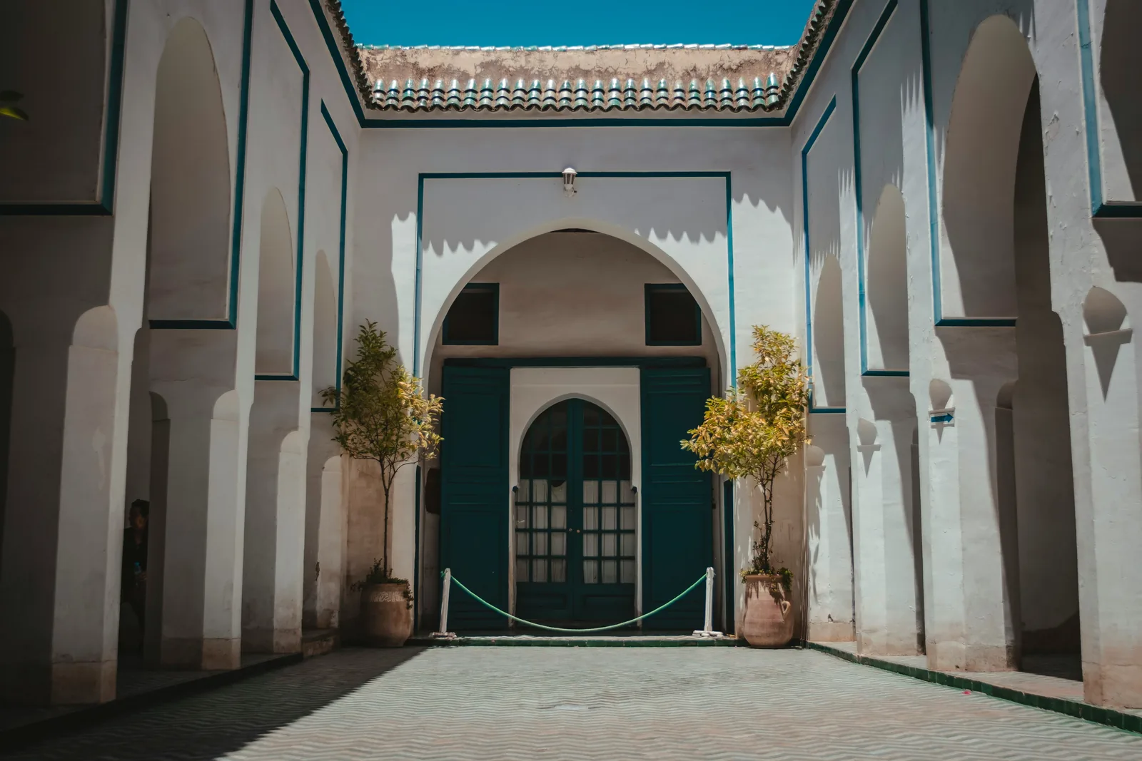 Arched doorway of a traditional Marrakech riad courtyard